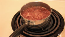 Adding the brown sugar and waiting till it melts and comes to a boil.